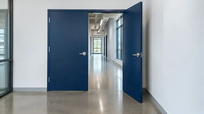 Blue double steel door in a corridor